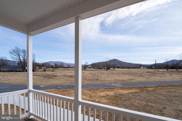 exterior space featuring a rural view and a mountain view