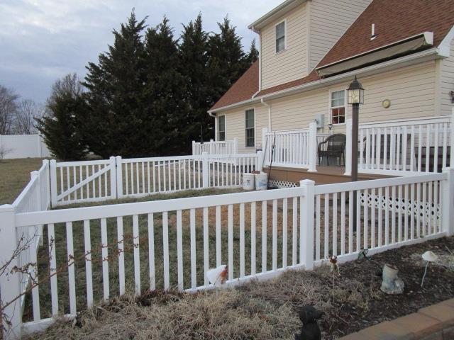 exterior space with fence private yard and a deck