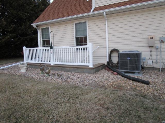 exterior space featuring roof with shingles and central air condition unit