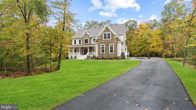 view of front of house featuring a porch and a front yard