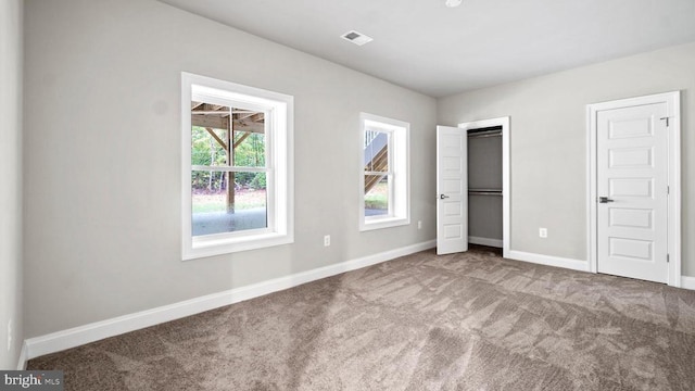 unfurnished bedroom with carpet flooring