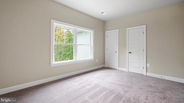 unfurnished bedroom featuring carpet