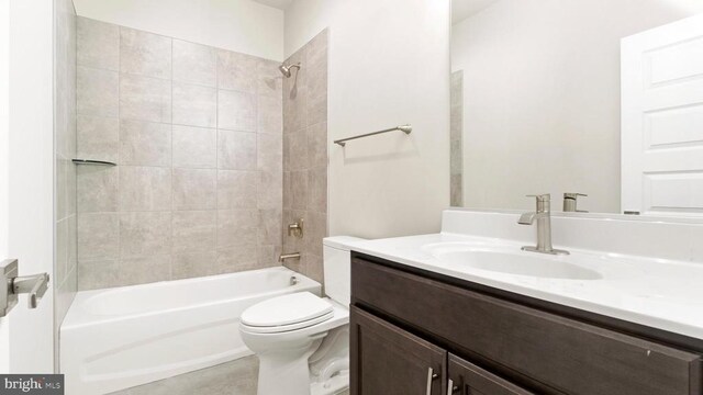 full bathroom with tiled shower / bath combo, vanity, and toilet