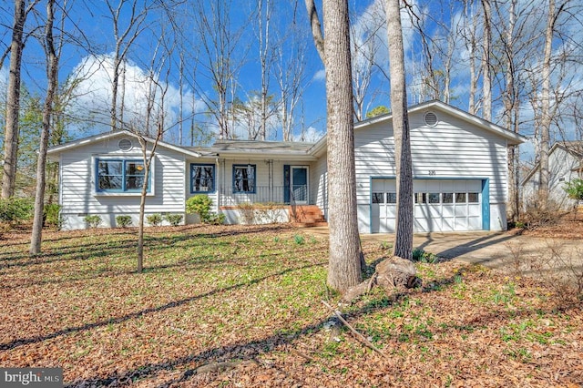 single story home featuring covered porch and driveway