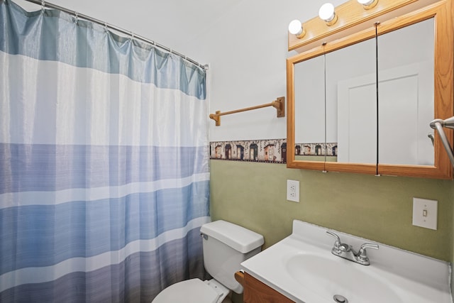 bathroom featuring vanity, toilet, and a shower with shower curtain