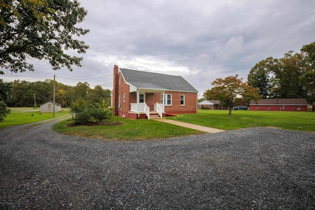 bungalow-style house featuring a front lawn