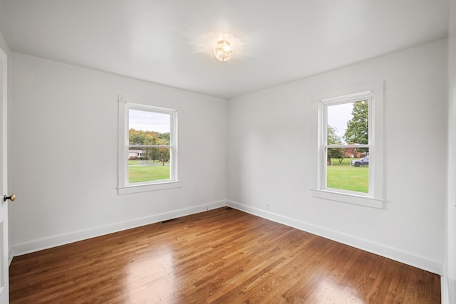 empty room featuring hardwood / wood-style flooring