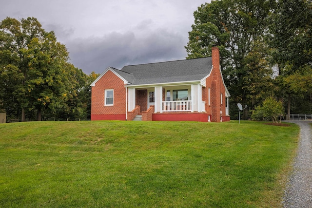 view of front facade with a porch and a front yard