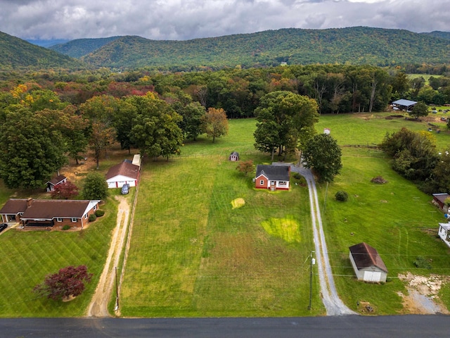 birds eye view of property featuring a mountain view and a rural view