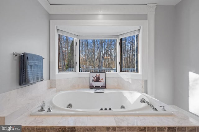 bathroom featuring a relaxing tiled tub