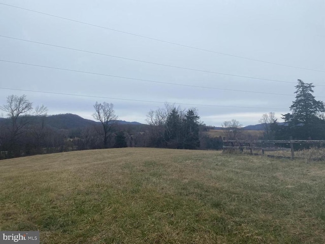 view of yard featuring a mountain view and a rural view