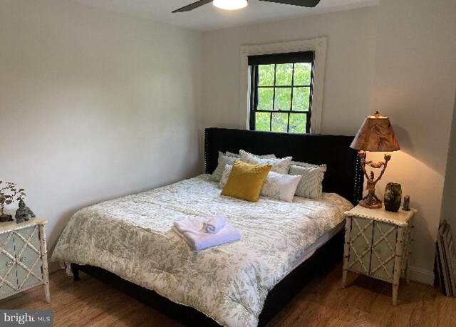 bedroom featuring ceiling fan and wood finished floors