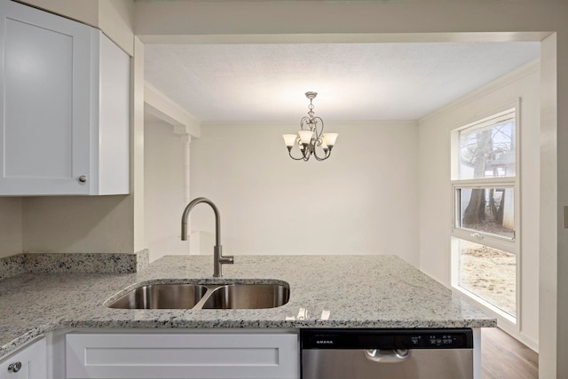 kitchen with white cabinetry, sink, light stone countertops, and dishwasher