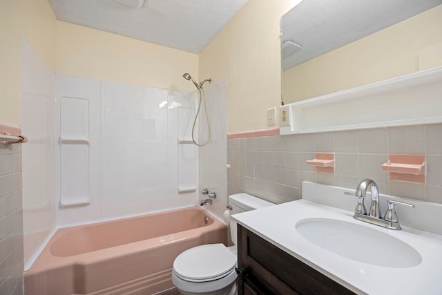 full bathroom with shower / bathing tub combination, a textured ceiling, tile walls, and toilet