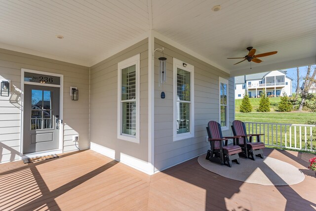 deck with a porch and ceiling fan