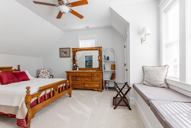 carpeted bedroom with lofted ceiling and ceiling fan