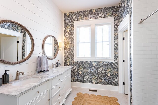 bathroom with tile patterned flooring and vanity