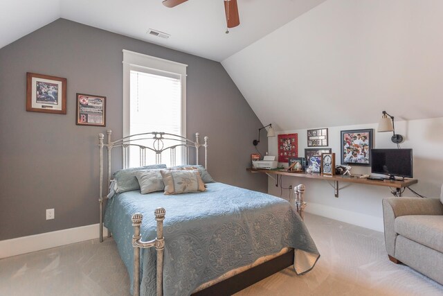 bedroom with ceiling fan, carpet flooring, and vaulted ceiling