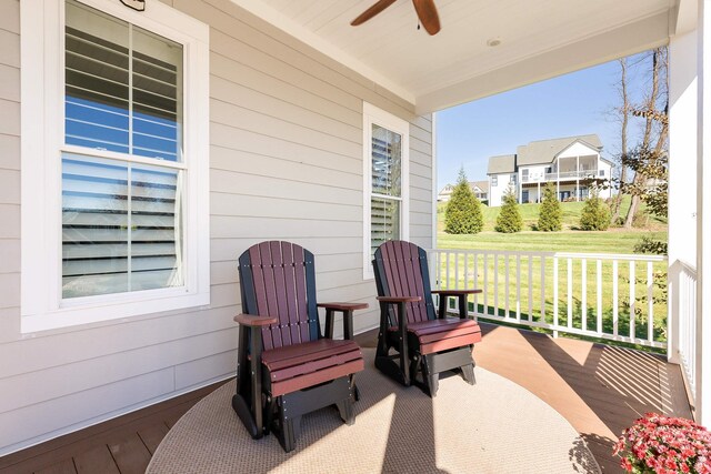 view of patio / terrace with ceiling fan and a porch