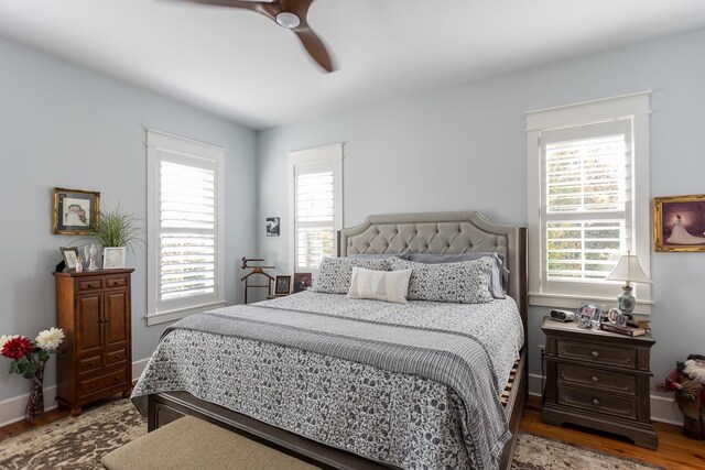 bedroom featuring wood-type flooring and ceiling fan