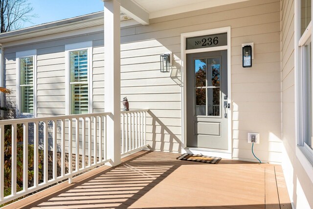 view of exterior entry with covered porch