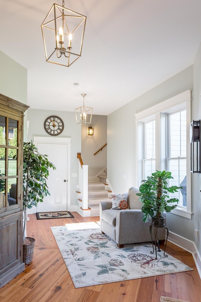 living room featuring hardwood / wood-style flooring and a chandelier