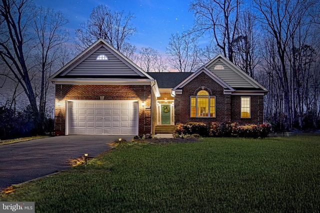 single story home with a garage and a yard