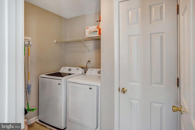 washroom featuring laundry area and independent washer and dryer