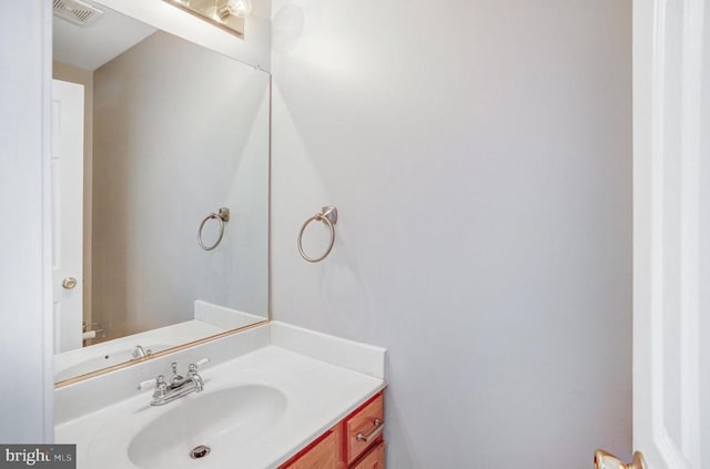 bathroom featuring visible vents and vanity