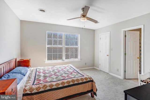 carpeted bedroom featuring baseboards, visible vents, and ceiling fan