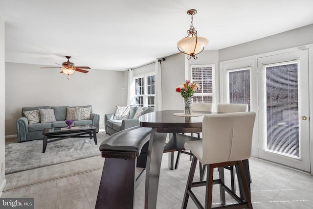 dining area with ceiling fan