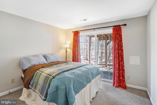 carpeted bedroom featuring visible vents, baseboards, and access to exterior