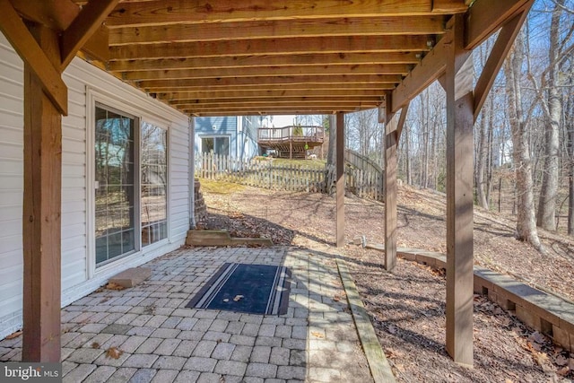 view of patio featuring fence