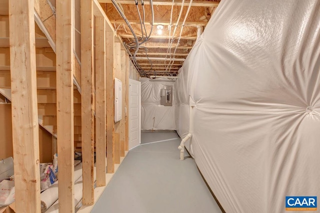 interior space featuring electric panel and concrete floors