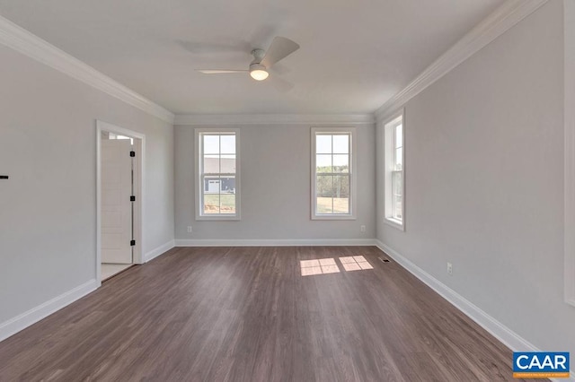 spare room with dark hardwood / wood-style flooring, ornamental molding, and ceiling fan