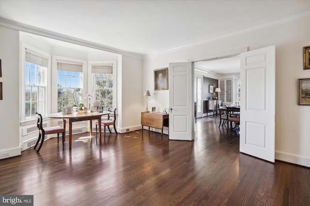 living area featuring ornamental molding and dark hardwood / wood-style flooring