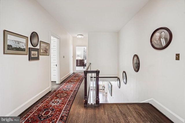 hallway featuring dark hardwood / wood-style flooring