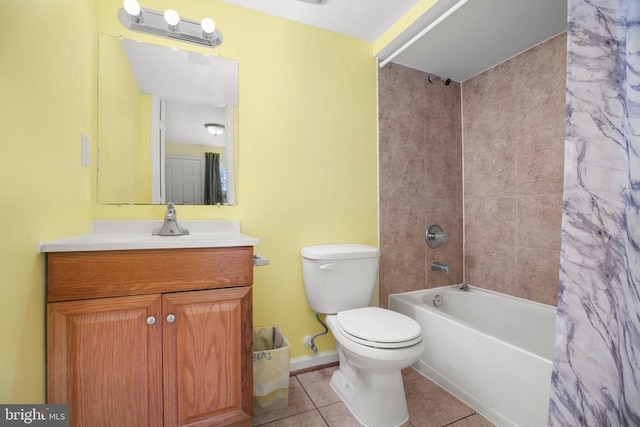 bathroom featuring toilet, shower / tub combo, tile patterned flooring, baseboards, and vanity