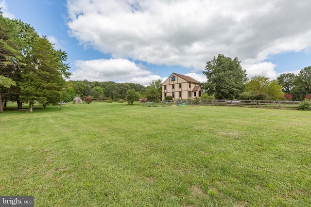 view of yard with a rural view