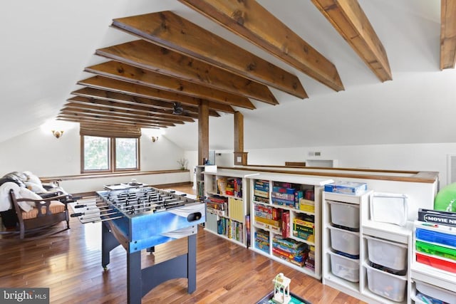 rec room featuring hardwood / wood-style floors and vaulted ceiling with beams