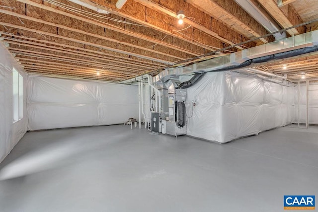 basement featuring heating unit