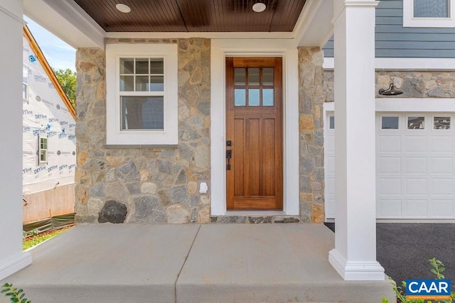 property entrance with a garage