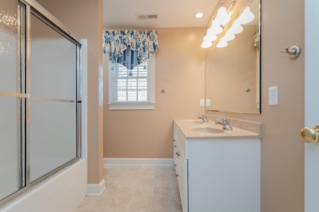 bathroom with vanity, tile patterned floors, and shower / bath combination with glass door