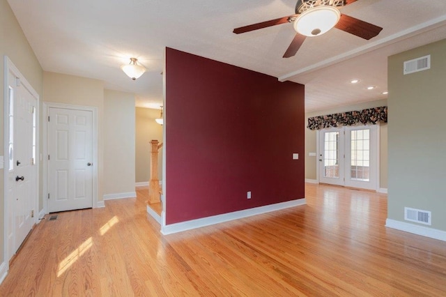 empty room featuring ceiling fan and light wood-type flooring