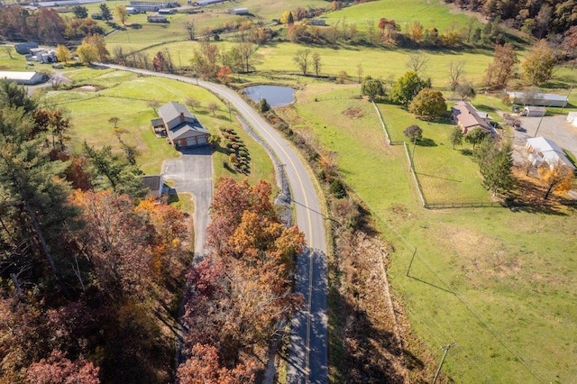 aerial view with a rural view and a water view