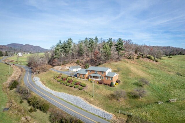 bird's eye view featuring a rural view and a mountain view