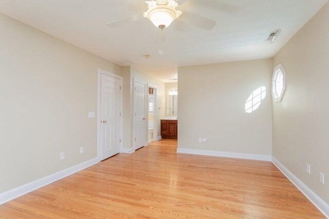 spare room with ceiling fan and light hardwood / wood-style floors