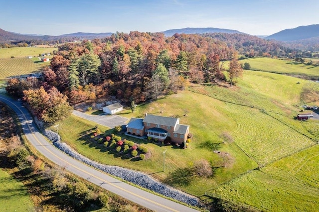 drone / aerial view featuring a mountain view and a rural view