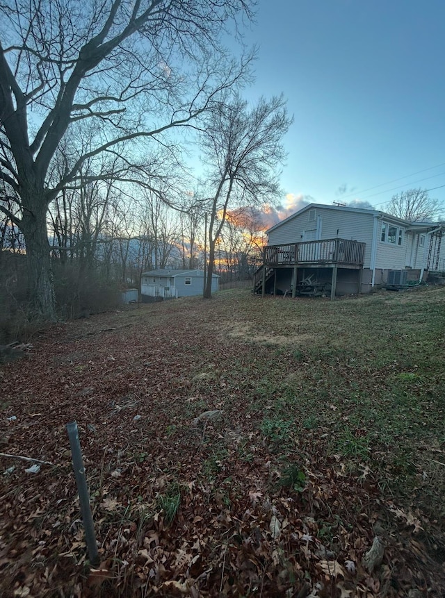 view of yard with a wooden deck