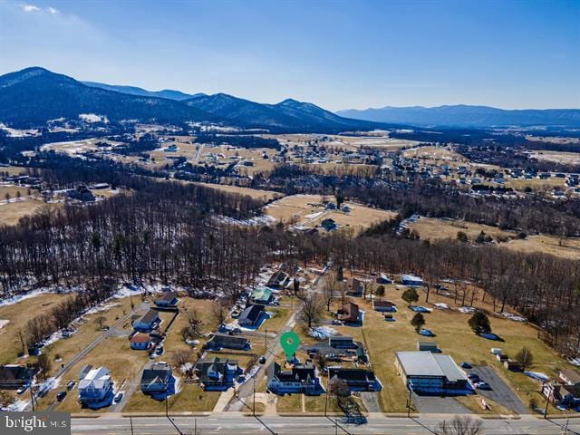 birds eye view of property featuring a mountain view